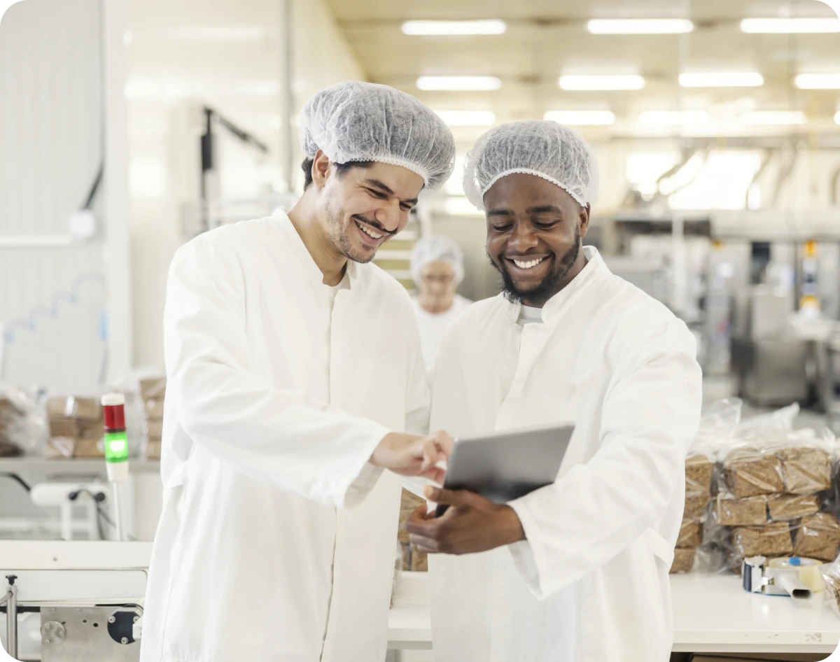 Smiling employees in a production facility